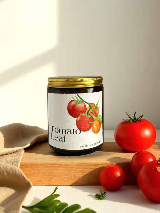 Tomato leaf coconut soy wax candle , hand poured into a cozy amber jar, made with non toxic ingredients.
